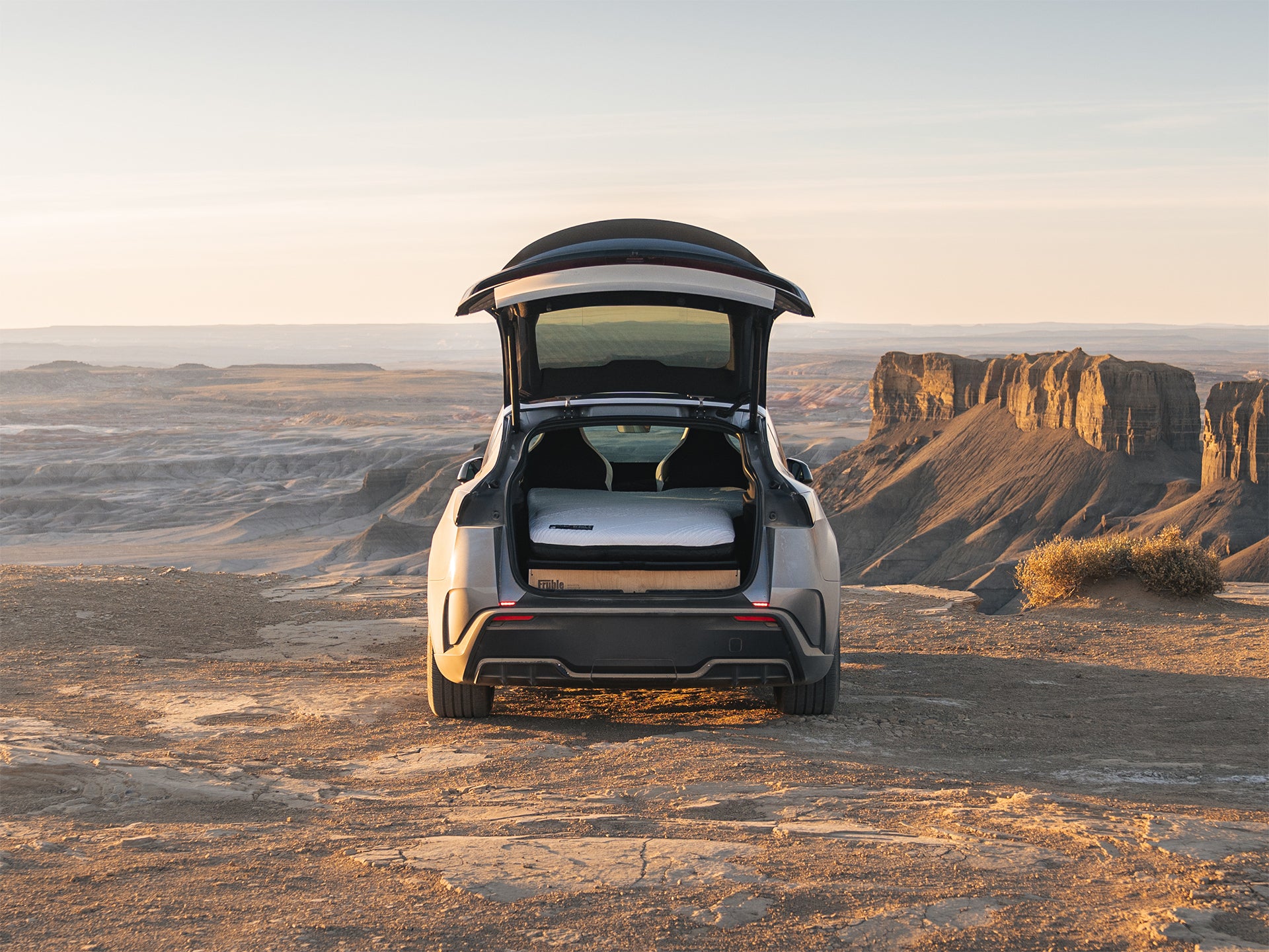 Fruble Ultralite camping kit in a Tesla Model Y in a desert landscape
