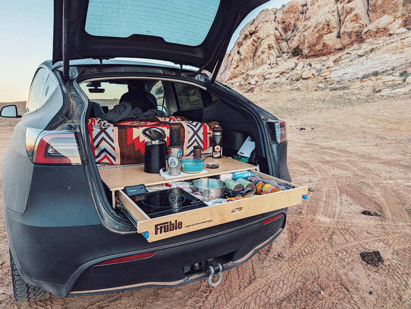 Tesla camping in the dessert with Fruble Camper Kit Lite drawer platform opened