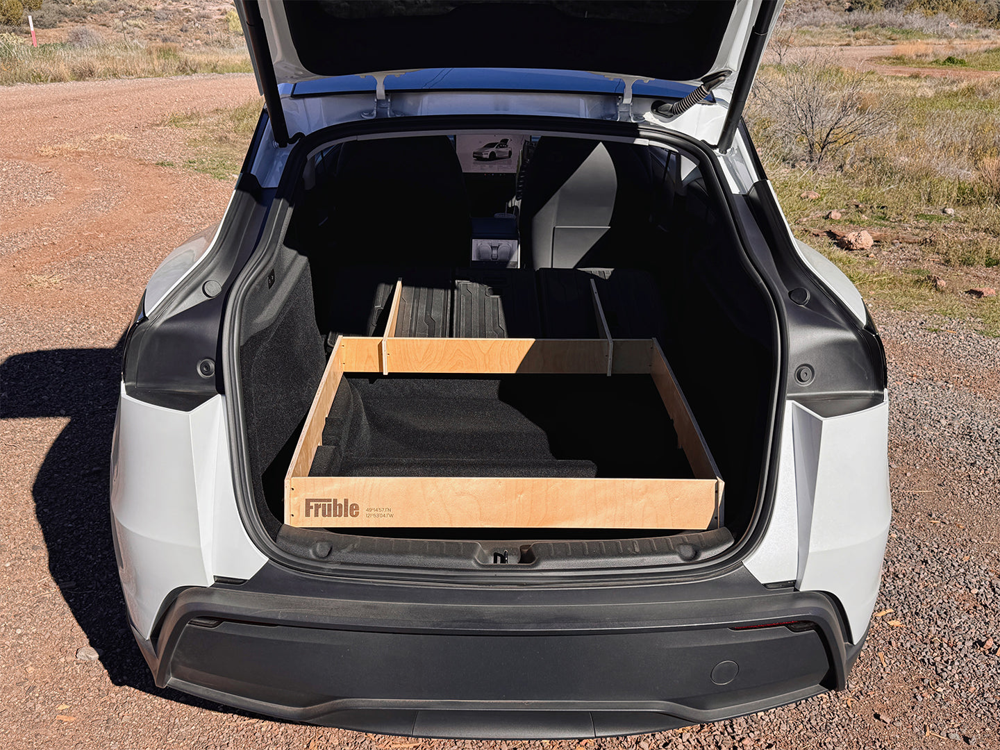 Camper Kit Ultralite level sleeping platform detail in Tesla Model Y interior
